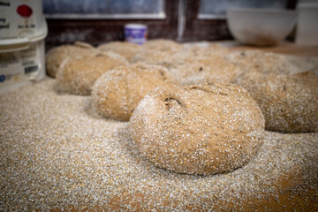 in bakery the loaves of bread lie side by side on the table
