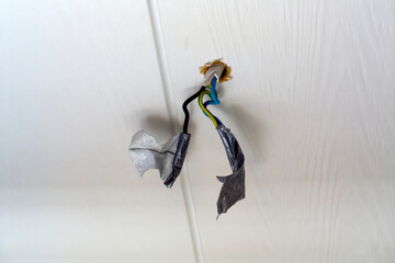 overhead lighting wires on the ceiling