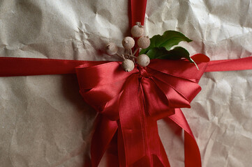 gift red bow on craft paper gorixontal