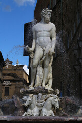 Fototapeta na wymiar Neptune monumental fountain detail in Signoria square, Florence (Tuscany), Italy
