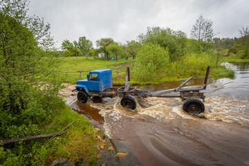 timber truck crosses the ford river