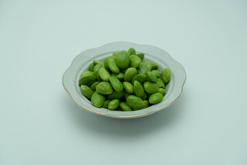 Bettter beans in bowl on white background