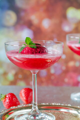 Festive vodka and prosecco cocktail with strawberry sorbet