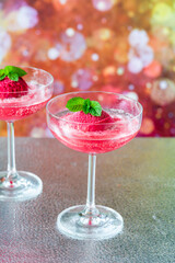 Festive vodka and prosecco cocktail with strawberry sorbet