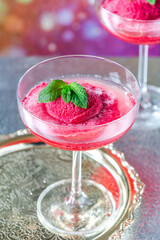 Festive vodka and prosecco cocktail with strawberry sorbet