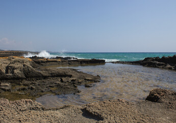Natural pool on a rock near the sea beach