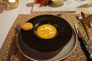 Close up bowl of pumpkin soup