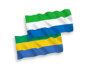 Flags of Gabon and Sierra Leone on a white background