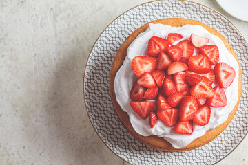 Whole summer berry cake, copy space. Vegan Strawberry Cake with Coconut Cream. Plant based dessert concept.