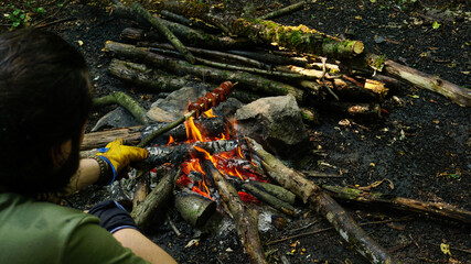 Obraz premium Cooking on campfire in forest, Camping in nature