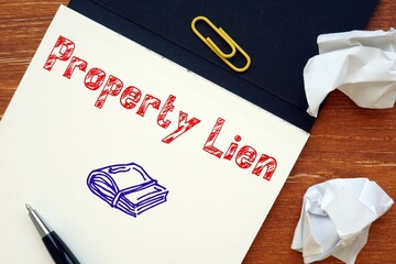 Business concept meaning Property Lien with phrase on the piece of paper.
