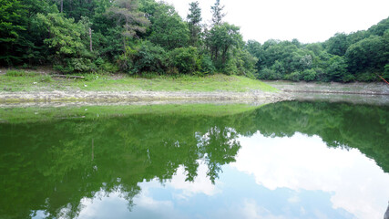 Lake in the forest, reflection in the water, beautiful scenery