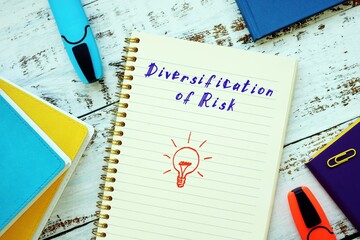 Business concept about diversification of risk with inscription on the piece of paper.
