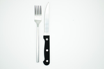 stainless fork and knife on white background