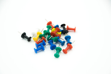 colored pushpins on a white background