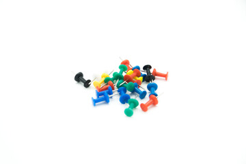 colored pushpins on a white background