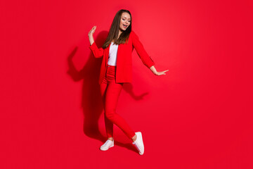Full length photo of attractive funny business lady successful worker having fun dance corporate party colleagues event wear blazer suit pants shoes isolated red color background