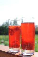 Traditional European non-alcoholic fruit beverage compote made from strawberries and rhubarb in summer