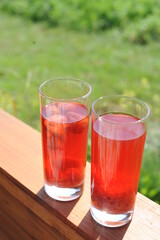 Traditional European non-alcoholic fruit beverage compote made from strawberries and rhubarb in summer