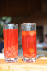 Traditional European non-alcoholic fruit beverage compote made from strawberries and rhubarb in summer
