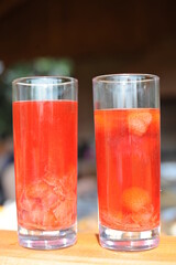 Traditional European non-alcoholic fruit beverage compote made from strawberries and rhubarb in summer