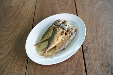 Deep fried mackerel with fish sauce, Traditional Thai food recipe.