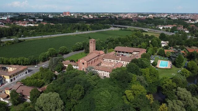 Aerial view of Pavia, Italy: San Lanfranco romanic church and city skyline on the background