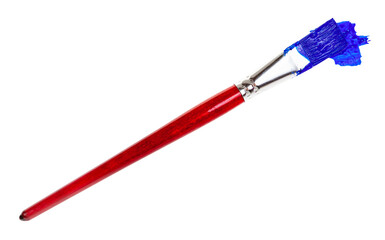 flat paint brush with ultramarine colored tip in blot and brown handle isolated on white background