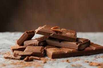 Tasty chocolate on gray background. Sweet food