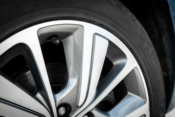 Close up of alloy car wheels.