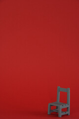 Wooden chair isolated on red background.