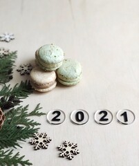 2021 concept flatlay with french desserts and christmas decorations