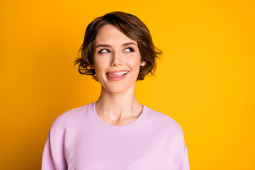 Portrait of positive cheerful girl look copyspace think thoughts lick lips want eat delicious dessert wear pullover isolated over shine color background