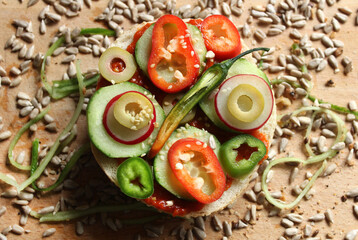 A sandwich with hot peppers, garlic and seeds 