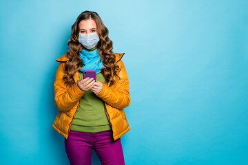 Portrait of her she nice attractive wavy-haired girl wearing safety mask using device browsing news...