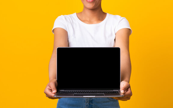 Girl Showing Black Blank Personal Computer Screen, Cropped