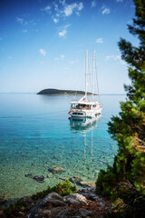 Beautiful seascape, a white yacht stands on the shore of the turquoise Mediterranean Sea