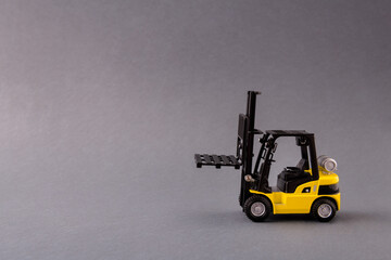 Photo of professional electric loader vehicle deliver service pallet move store mall market supply isolated over dark pastel grey color background