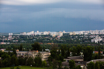 Fototapeta na wymiar Chisinau, the capital city of the Republic of Moldova. Storm clouds over city. Cloud over the city at the sunset.