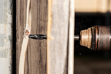 Concept: The danger of drilling through a electrical cable in the wall