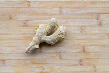 Portion of root ginger on a wooden table