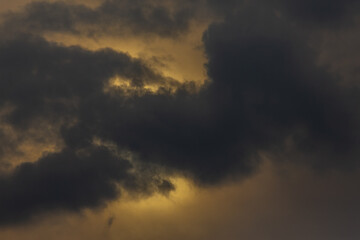 Thunderclouds on a gray sky. Beautiful background