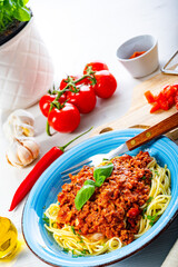 Delicious spaghetti bolognese on white background