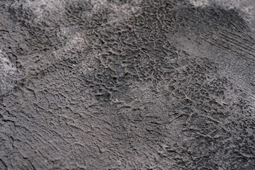Grey background plaster wall background pattern with high resolution. The view from the top. A copy of the space.