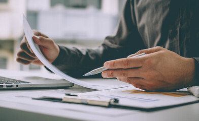 Business people check the graph of the growth of his company