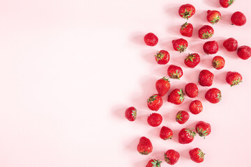 Strawberry on pastel pink background. Flat lay, top view