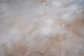 Grey-brown concreted wall for internal rooms or external open surface of polished concrete. Cement, sand and stone tones vintage, natural patterns vintage, design artwork floor texture background