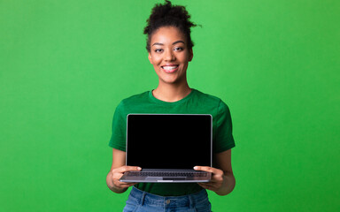 Girl showing black blank personal computer screen