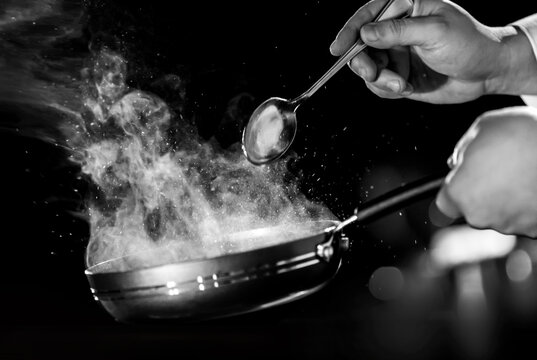 Chef preparing food in the kitchen, chef cooking.
