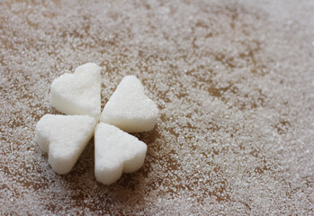 А clover figure formed from heart-shaped sugar candy